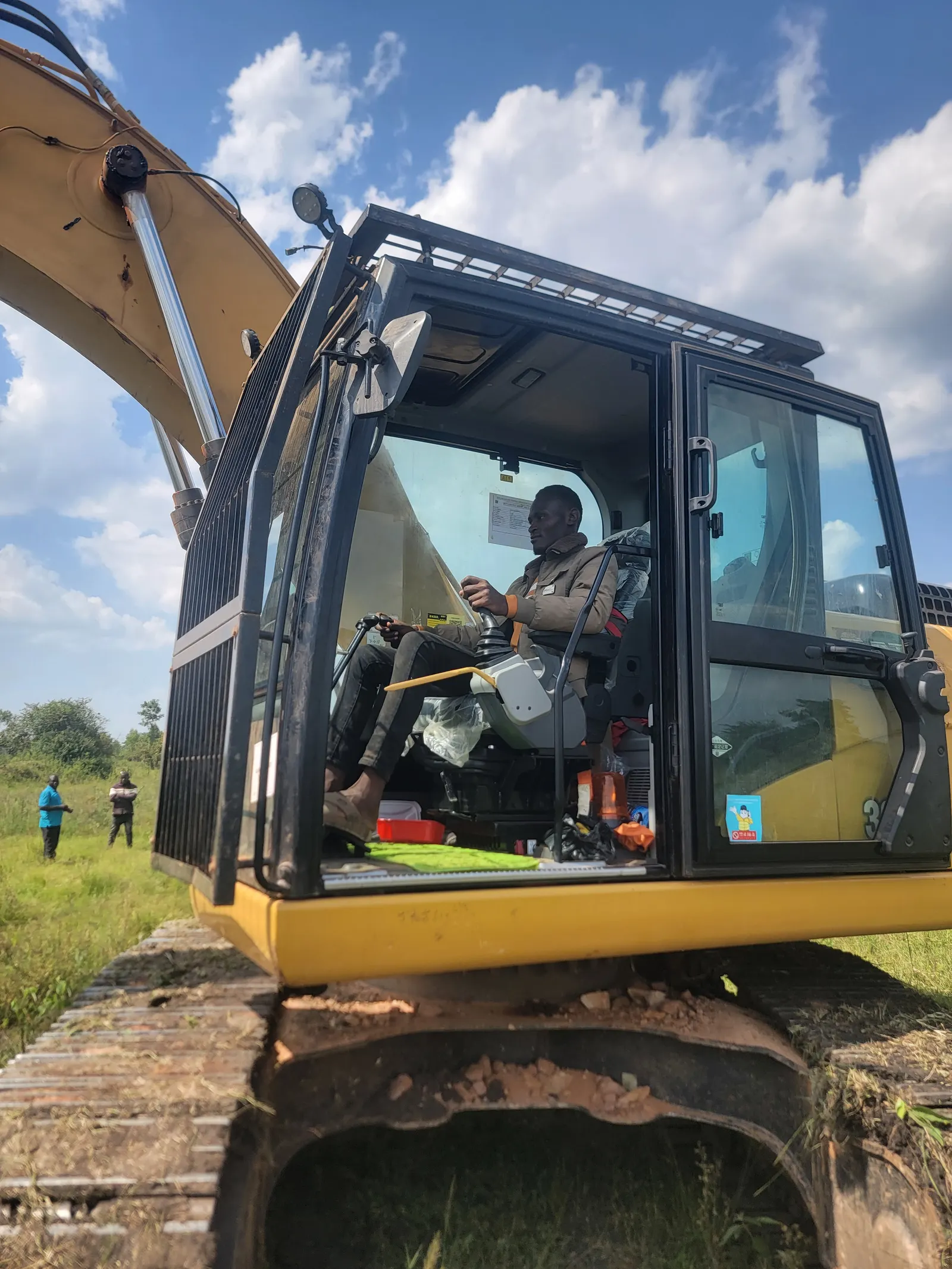 Operator working in an excavator cab
